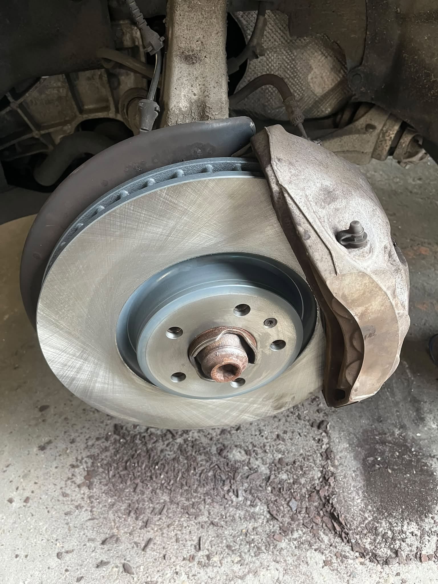 Brake disc and caliper stripped for inspection